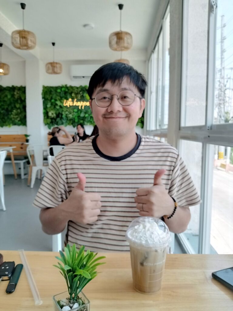 An image of a man enjoying a cup of coffee.