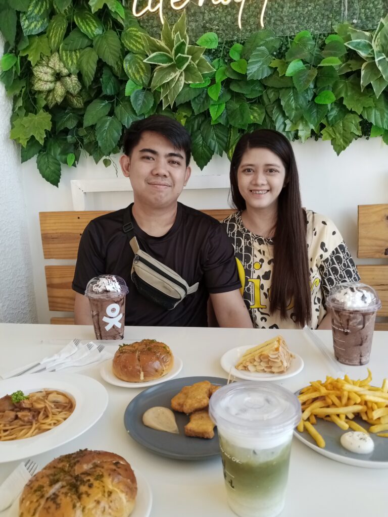 An image of a couple with the set of meal from Ok Cafe PH