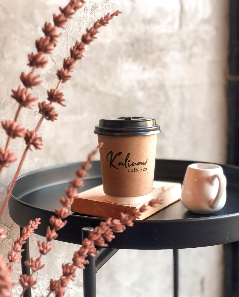 An Image of Kalinaw Coffee Co takeout cup of coffee