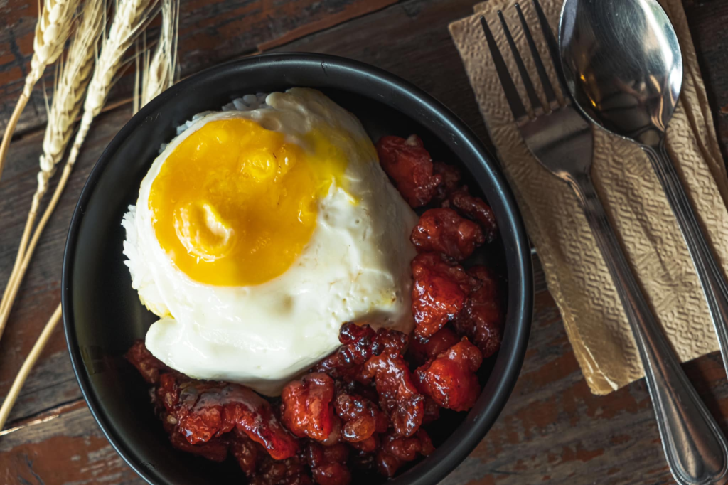 An Image of Kalinaw Coffee Co serving a bowl of tocino rice meal